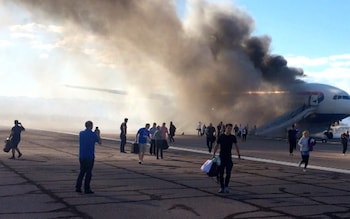 Plane passengers ‘risking their lives’ by rescuing their bags during evacuations