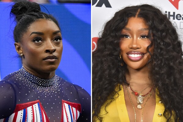 SZA shows off gymnastics skills in a friendly handstand contest with Simone Biles