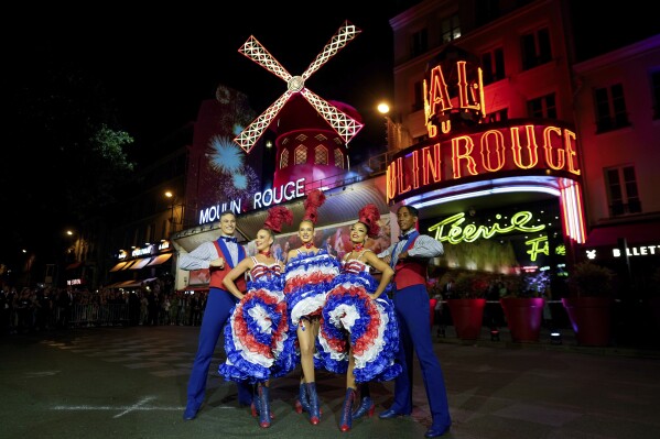 The Moulin Rouge cabaret in Paris has its windmill back, after a stunning collapse