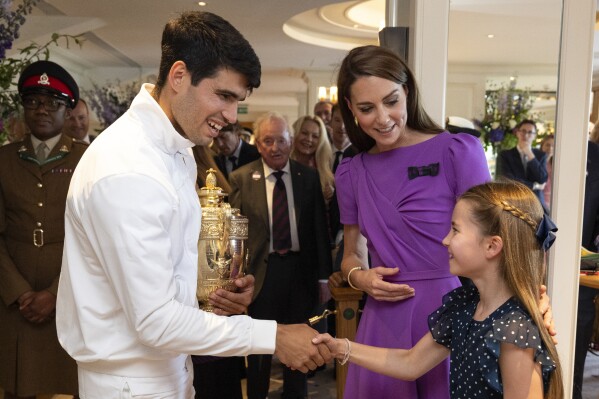 Kate, the Princess of Wales, hands Carlos Alcaraz his Wimbledon trophy in a rare appearance for her