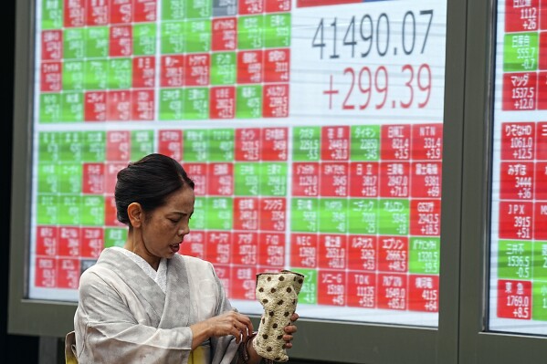 Stock market today: Asian stocks are mixed after Dow sets a new record