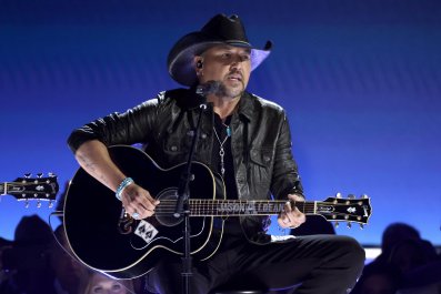 Jason Aldean Kicks Enthusiastic Fan Out Of Concert With Police Escort