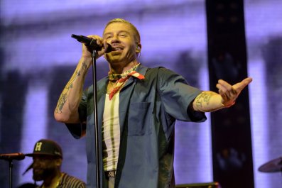 Fan Gets Onstage With Macklemore, Had 'Forgotten' She's Wanted by Police