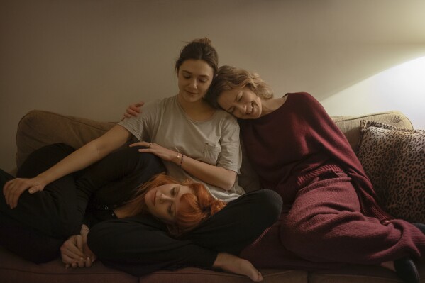 Movie Review: Coon, Olsen and Lyonne await a father’s death in ‘His Three Daughters’