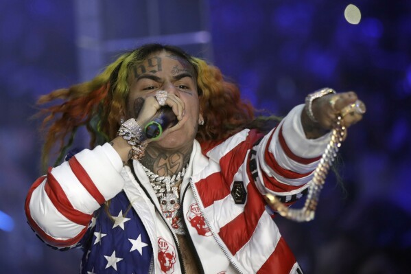 Rapper Tekashi 6ix9ine is arrested in New York for a possible parole violation